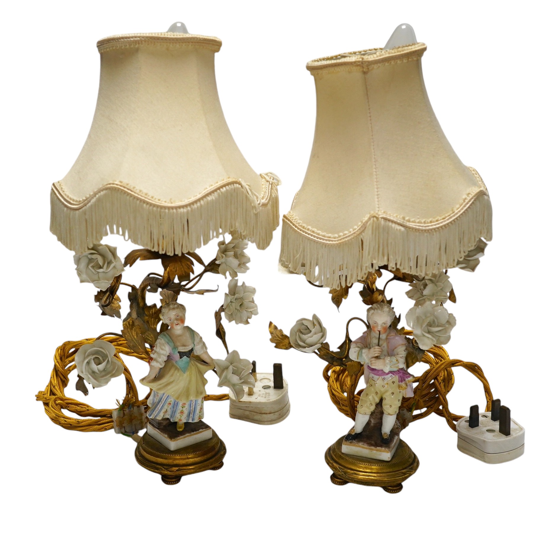 A pair of German figural porcelain and ormolu mounted table lamps with shades, overall 32cm high. Condition - fair to good, minor losses